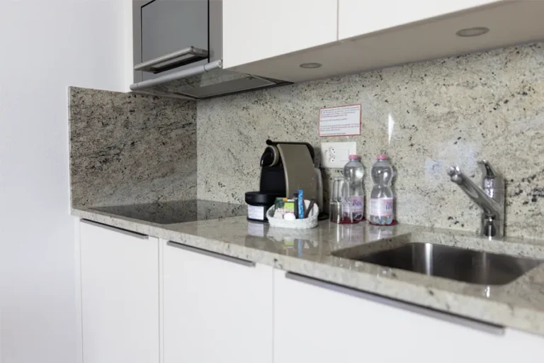 Kitchen area of a furnished apartment for temporary living at Hotel Schlössli Ipsach